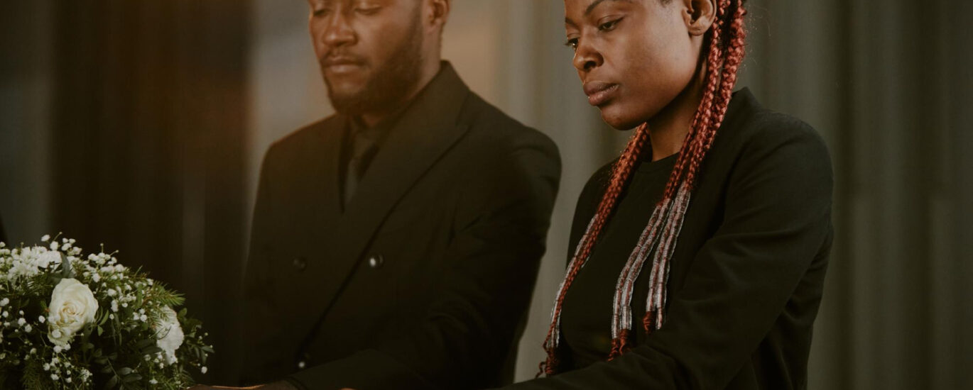 african siblings at a funeral