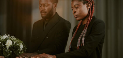 african siblings at a funeral