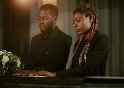 african siblings at a funeral