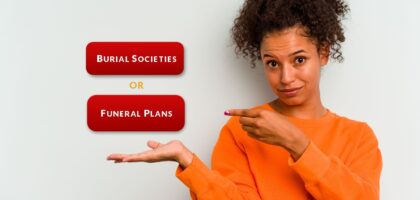 A young african woman pointing to two choices on her right.